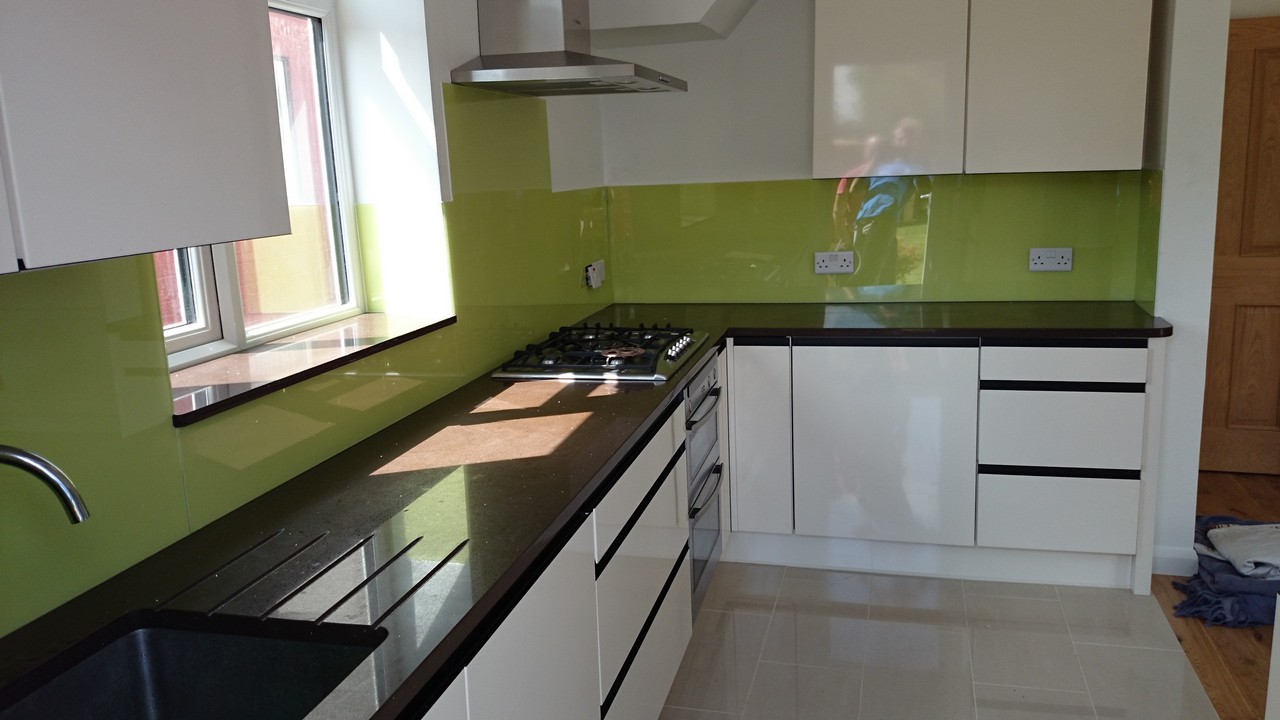 Lime green glass kitchen splashback installed by Canning Town glaziers